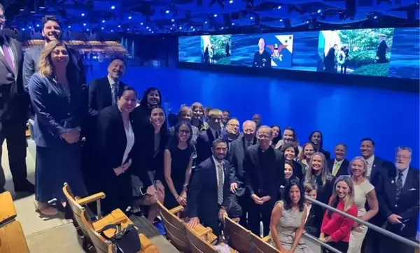Large Notre Dame presence at Admiral Grady retirement ceremony posing for a photo together